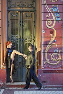 Professional Tango Dancers with 'Filieteado Art'in the background, Jean Jaures street, Abasto, Buenos Aires
