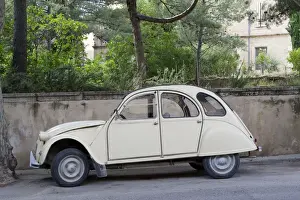 Stone Wall Prints: Provence, France. An old Citroen on the street in a small town in rural France