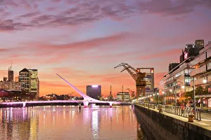 The Puente de la Mujer bridge illuminated at twilight, Puerto Madero, Buenos Aires, Argentina