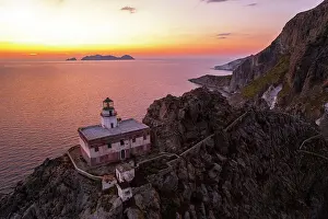 Tyrrhenian Prints: Punta della Guardia lighthouse on top of a basaltic cliff with Palmarola island in the background