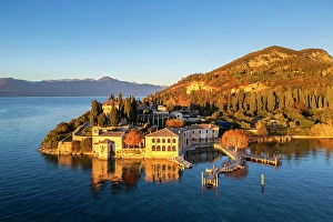 Garda Lake Prints: Punta San Vigilio at sunset in autumn. Garda, Verona district, Italy