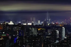 Pyongyang Prints: Pyongyang, new modern buildings in the centre of Pyongyang colourfully illuminated