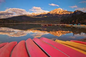 Images Dated 3rd May 2023: Pyramid Mountain and canoes on Pyramid Lake, Jasper National Park, Alberta, Canada