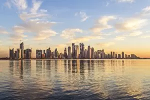 Arabian Peninsula Collection: Qatar, Doha. Cityscape at sunrise from the Corniche