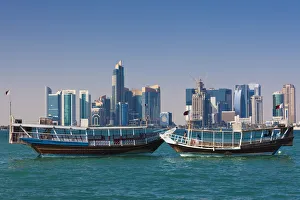 Qatar, Doha, Dhows on Doha Bay with West Bay skyscrapers