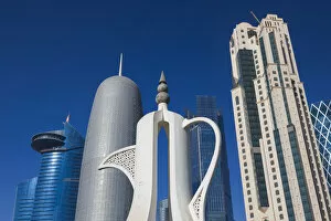Images Dated 21st March 2016: Qatar, Doha, Doha Bay, West Bay Skyscrapers, morning, with large coffeepot sculpture