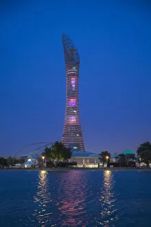 Images Dated 17th June 2013: Qatar, Doha, The Torch Hotel reflecting in the lake in Aspire Park