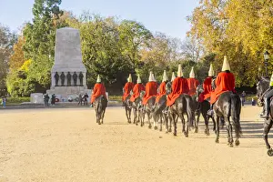 The Queens guards during the Changing of the Guard marching towards the Guards Memorial, London, England, UK