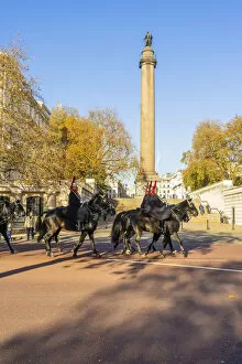 Images Dated 13th January 2022: The Queens guards during the Changing of the Guard marching past the Duke of York Monument