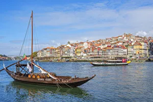 Rabelo boats with river Douro and Ribeira, Porto, Portugal