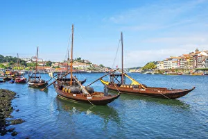 Rabelo boats with river Douro and Ribeira, Porto, Portugal