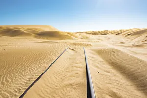 Luderitz Prints: Railway tracks leading into a sand dune, Luderitz, Namibia, Africa