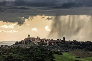 Rain Clouds Prints: Rain clouds passing over the medieval hill town of Monticchiello, Tuscany, Italy
