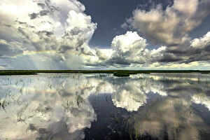 Images Dated 29th August 2023: Rainbow over Swim Creek floodplain, Bamurru Plains, Northern Territory, Australia