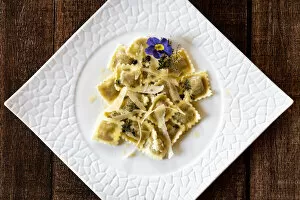 Images Dated 18th May 2021: Ravioli traditional pasta stuffed with game meat in white dish from above