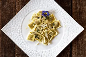 Food Gallery: Ravioli traditional pasta stuffed with game meat in white dish from above