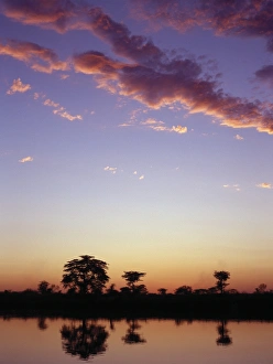 Shadow Gallery: The last rays of the setting sun over the Okavango River at Rundu