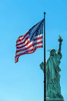 Images Dated 28th September 2022: Rear side of Statue of Liberty with US flag, Liberty Island, New York, USA