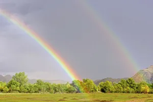 Thunderstorm Prints: Receding storm clouds and a rainbow over a prairie dog colony