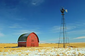 Agribusiness Prints: Red barn and windmill Vulcan, Alberta, Canada