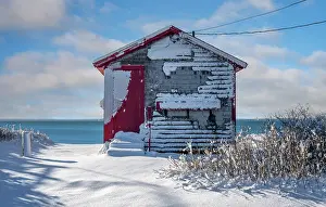 Snow Flurry Prints: Red beach house with snow on Cape Cod, Falmouth Heights, Massachusetts, USA