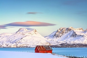 Mountain Peak Prints: Red cabin and snowy mountains at sunrise, Tromso, Norway