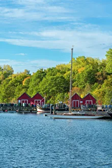 Cabins Prints: Red cabins against colorful trees in autumn