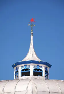 Roof Prints: A red dragon weather vane on the top of Pier Pavilion on Llandudno Pier