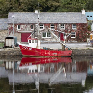 A red fishing boat moored on Newport river, Newport, County Mayo, Connacht province