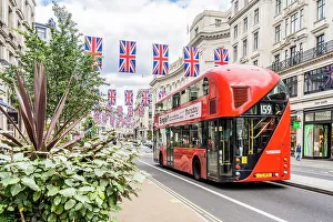 Regent Street Prints: A red London bus and Union flags on Regent street, London, England, UK