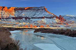 Canyons Prints: Red rock formations and Colorado River with snow in winter near sunset