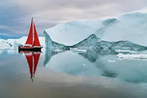 Danish Territory Prints: Red sailboat and icebergs in Disko Bay, Greenland