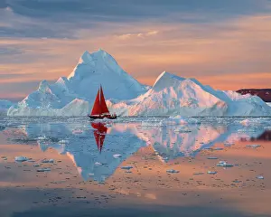 Michael Blanchette Prints: Red sailboat at sunset near icebergs in Disko Bay, Greenland