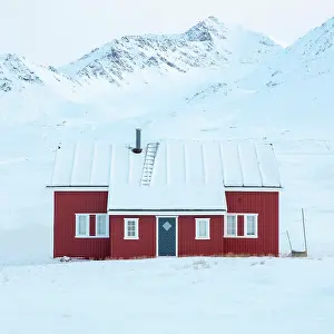 Remote Prints: Red timber house in remote former mining town of Ny Alesund
