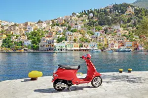 Aegean Prints: Red vespa scooter parked at Gialos harbour