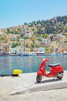 Aegean Prints: Red vespa scooter parked at Gialos harbour