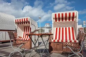 Beach Chair Prints: Red and white beach chairs in a beach restaurant at the pier of Prerow