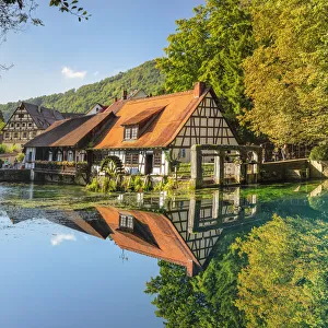 Mill reflecting in Blautopf Spring, Blaubeuren, Swabian Jura, Baden-Wurttemberg, Germany
