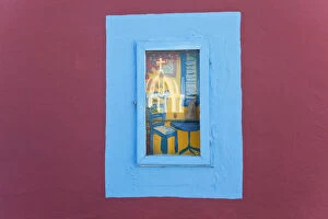 Reflection of church in picture window, Santorini (Thira), Cyclades, Greece