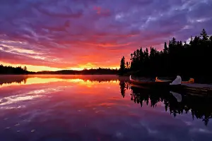 Quebec Prints: Reflection of clouds in Lac du Fou at sunrise with canoes La Mauricie National Park