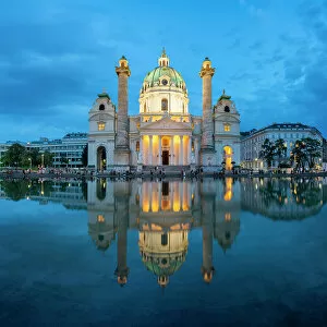 City Square Gallery: Reflection of illuminated Karlskirche at Karlsplatz at twilight, Innere Stadt, Vienna, Austria