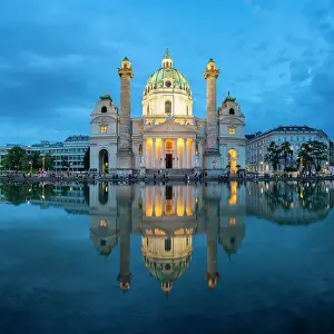 Town Squares Prints: Reflection of illuminated Karlskirche at Karlsplatz at twilight