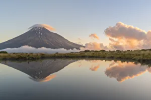 Reflection of Mount Taranaki at sunset. Egmont National Park, New Plymouth district