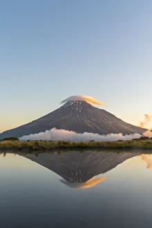 Reflection of Mount Taranaki at sunset. Egmont National Park, New Plymouth district