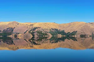 Cuzco Region Prints: Reflection of mountains on shore of Laguna Pomacanchi