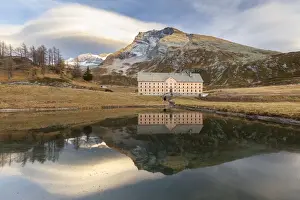 Alpi Pennine Prints: Reflection of the new hospice and Monte Leone in a small pond at the top of the Simplon