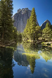 Reflection of trees in Merced River by Cathedral Rocks, Yosemite National Park
