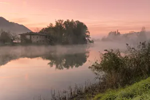 Adda Gallery: Reflections on Adda river at a foggy dawn, Lecco Province, Lombardy, Italy