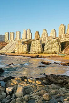 Images Dated 24th August 2022: Residential high-rise buildings at Playa Cochoa at sunset, Vina del Mar, Valparaiso Province