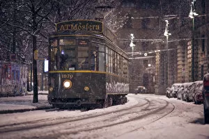 Snowfall Collection: The restaurant tram 'ATMosfera'traveling in Piazza Castello in Milano during a
